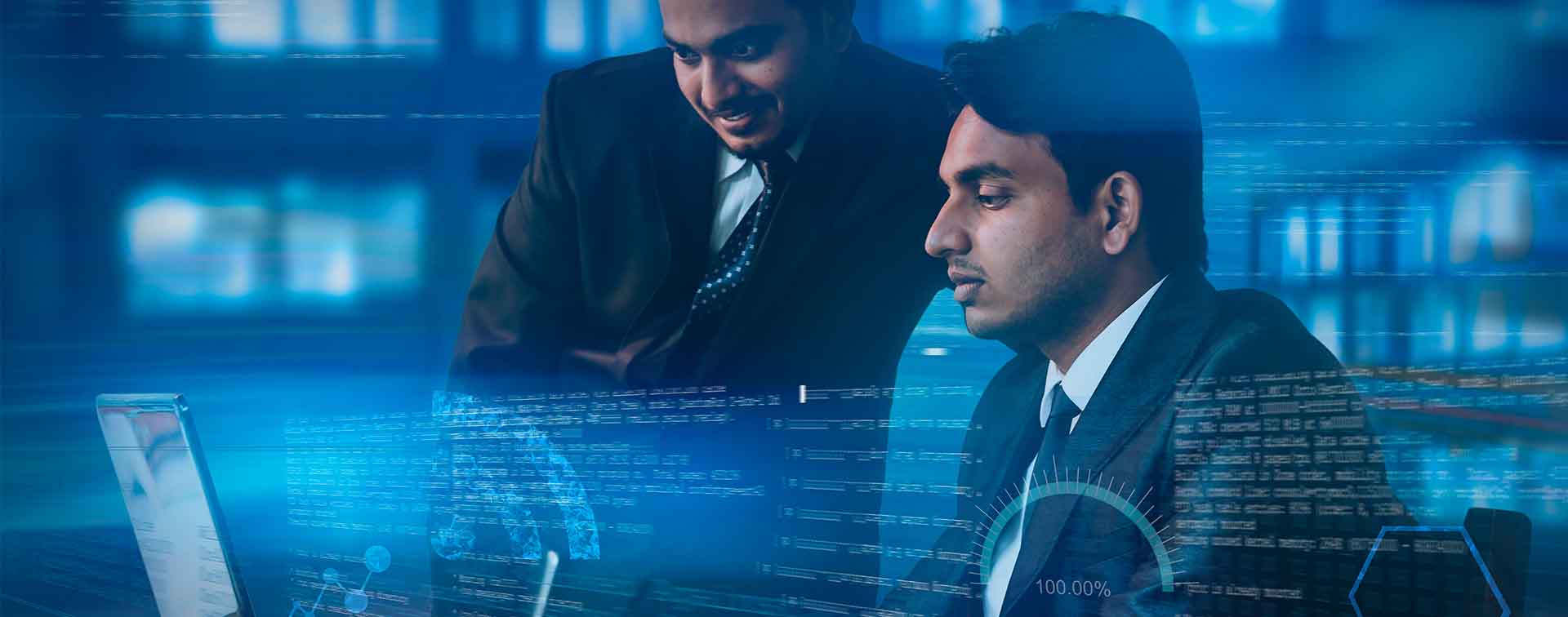 Two Indian businessmen working on a laptop