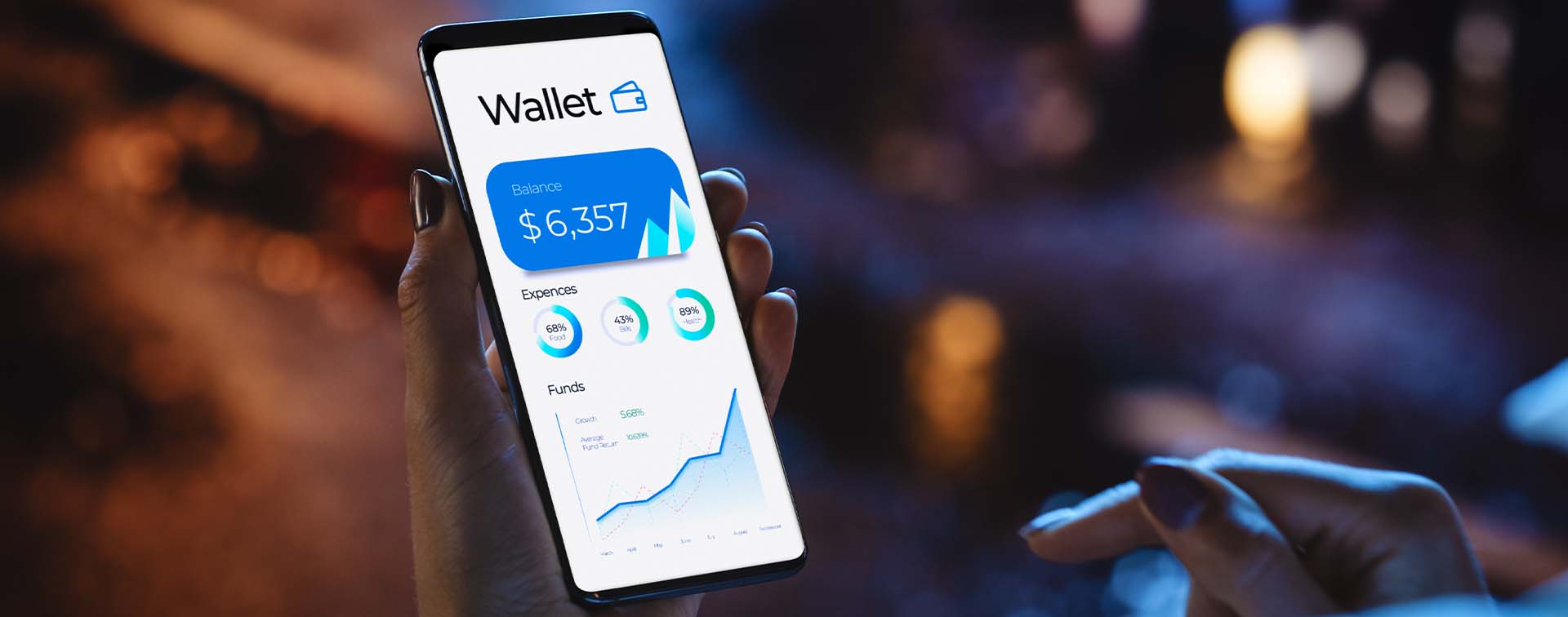 Woman using smartphone for checking balance of online wallet while standing on a neon-lit city street 