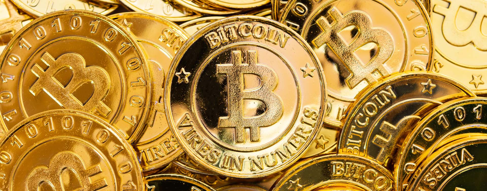 Bitcoin cryptocurrency background. Golden bitcoin, digital currency