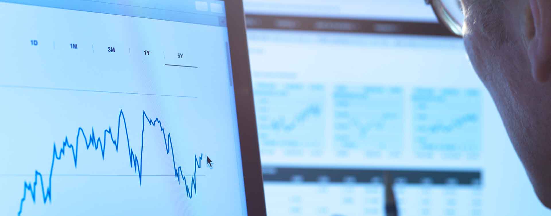 Man viewing data and charts on screen