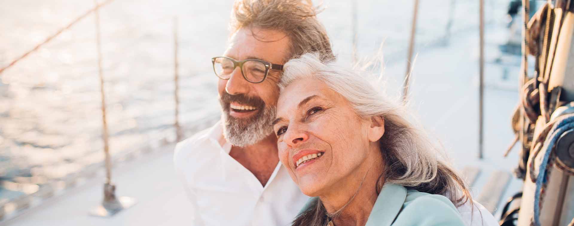 Senior couple in love sailing together