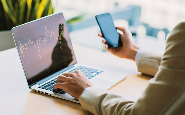 Businessman analyzing stock graph