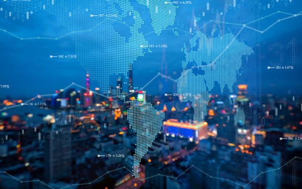 Futuristic earth map with data overlays and blurred cityscape background