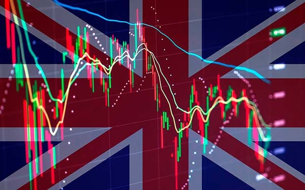 A graph showing the movement of the stock market overlaid on the UK flag
