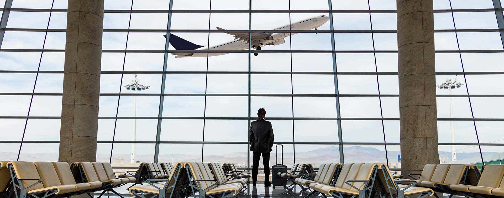 Businessman with luggage waiting in the airport