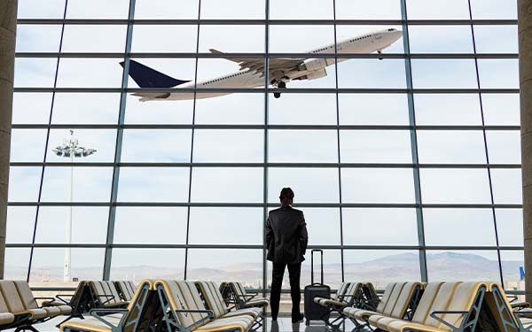 Businessman with luggage waiting in the airport