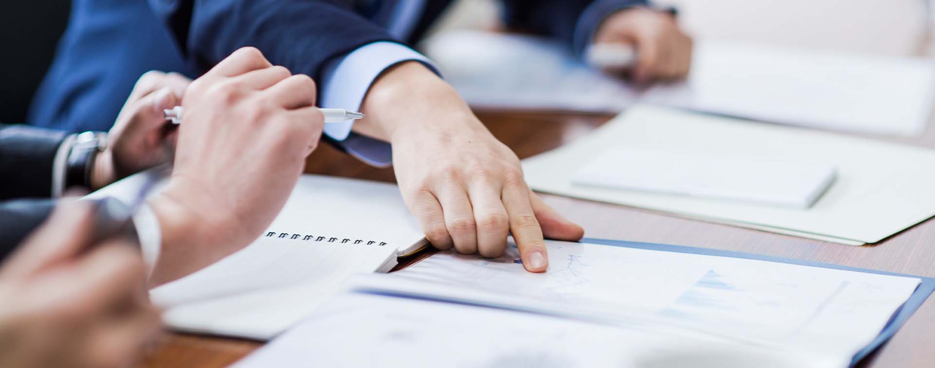 Three businessmen meeting in a conference room