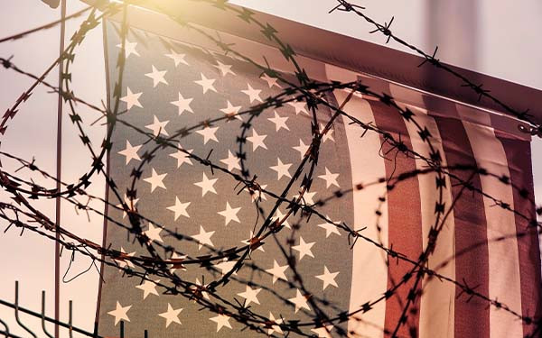 American flag and barbed wire, USA border