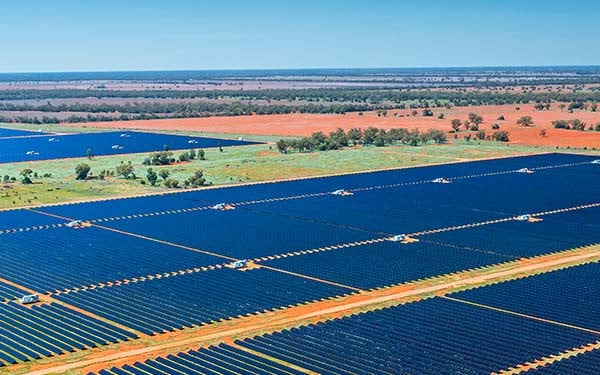 Rows of solar panels in an open field in New South Wales, Australia
