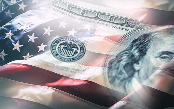 USA flag and American dollars. American flag blowing in the wind and 100 dollars banknotes in the background