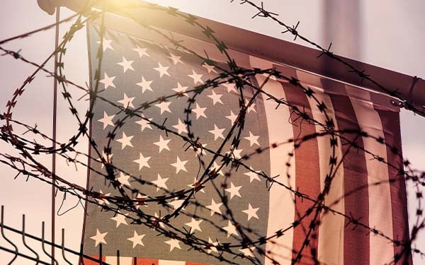 American flag and barbed wire, USA border