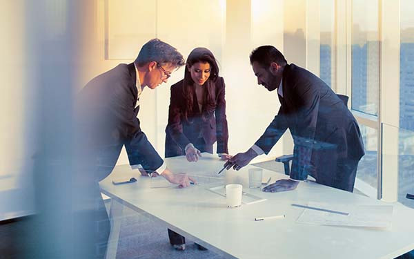Business colleagues planning together in meeting