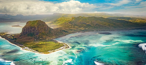 Aerial view of the underwater waterfall and Le Morne Brabant peninsula. Amazing Mauritius landscape